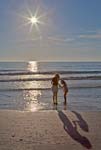 Shooting the Sun - At The Beach - 6745 - Photograph by H. David Stein